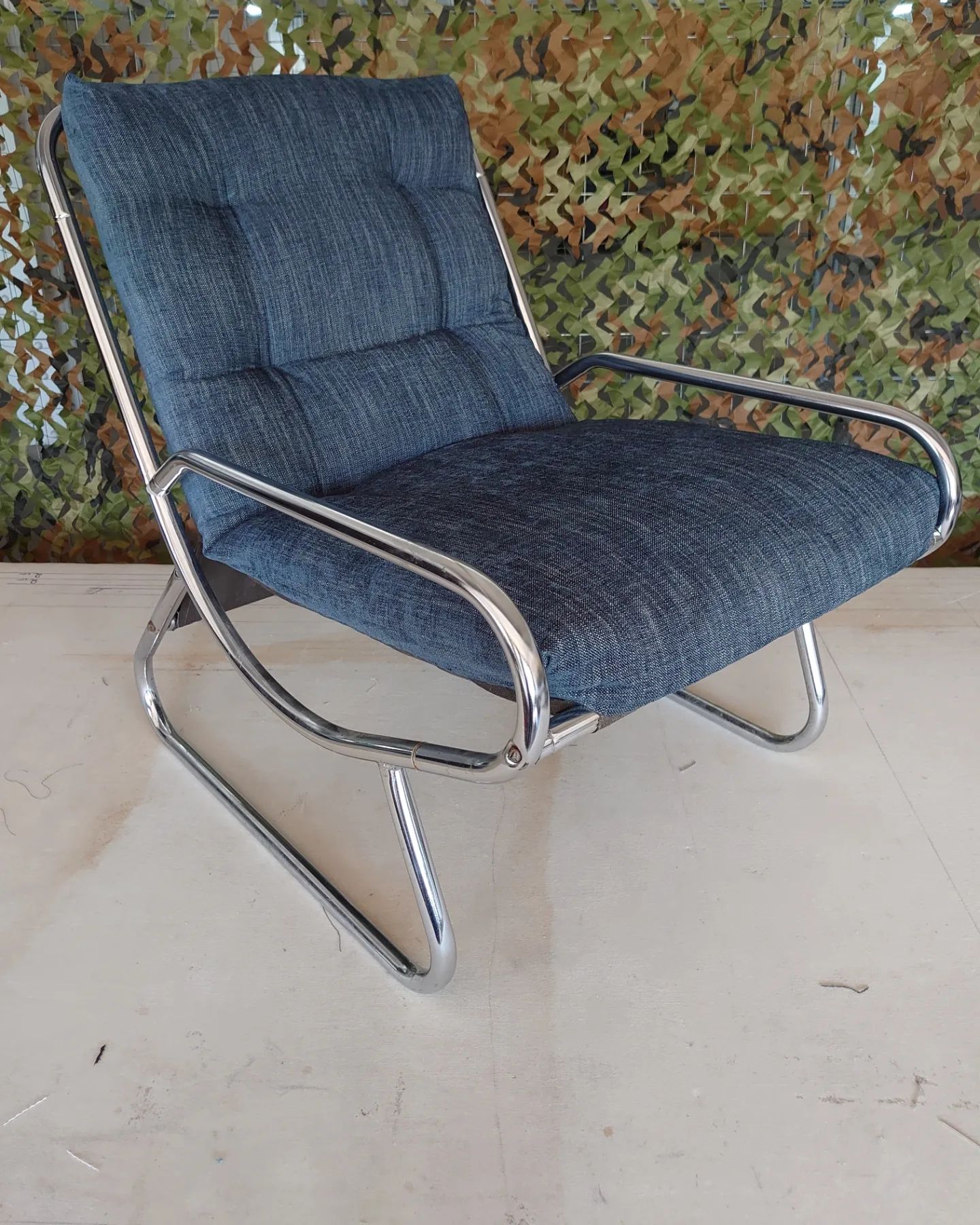 A blue fabric metal framed mid century modern chair reupholstered for
