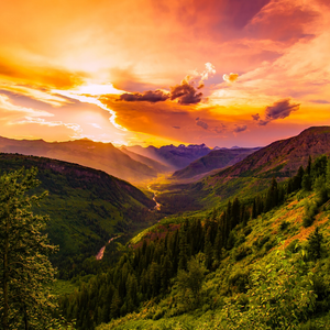 sunset over mountain valley