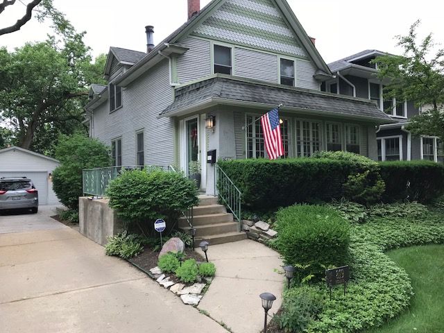 A house with an american flag in front of it