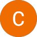 The letter c is in an orange circle on a white background.