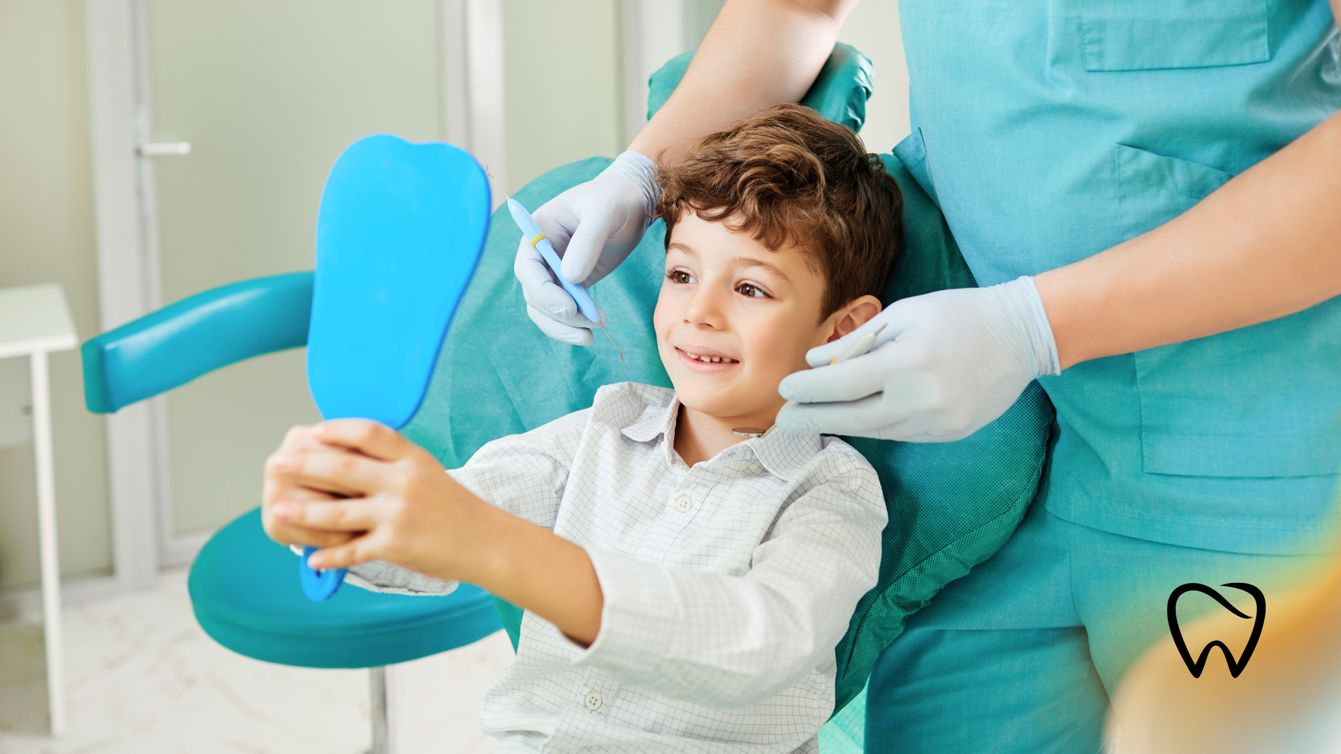 Child in dentist chair looking in mirror held by dentist.