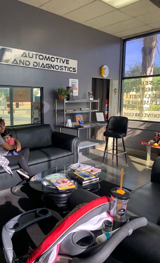 Auto repair waiting room with black chairs and shelving | O.C. Automotive and Diagnostics