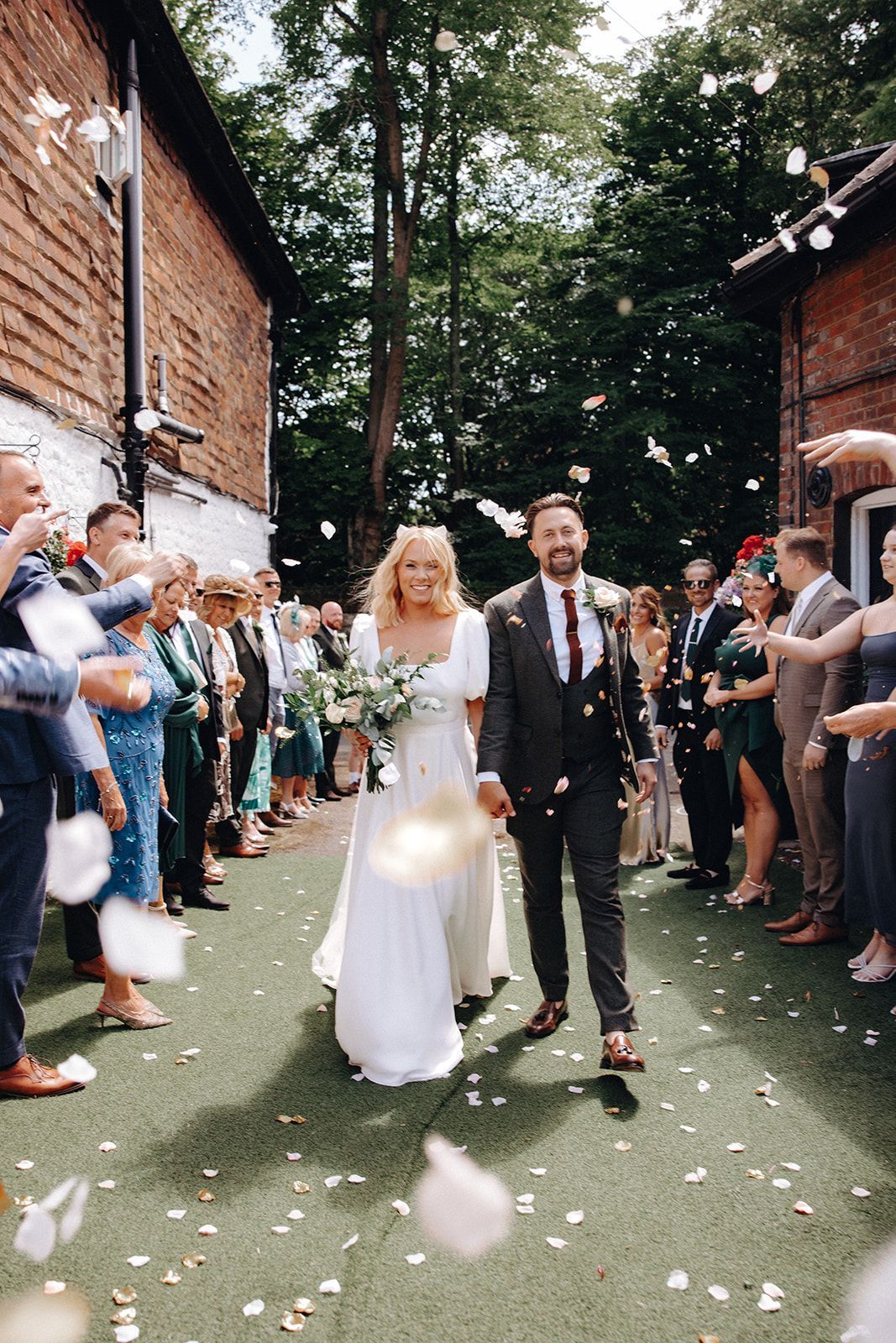 The happy couple, showered by confetti