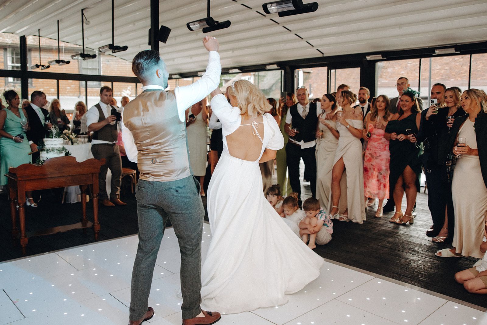 The bride and groom dancing away in the Glasshouse