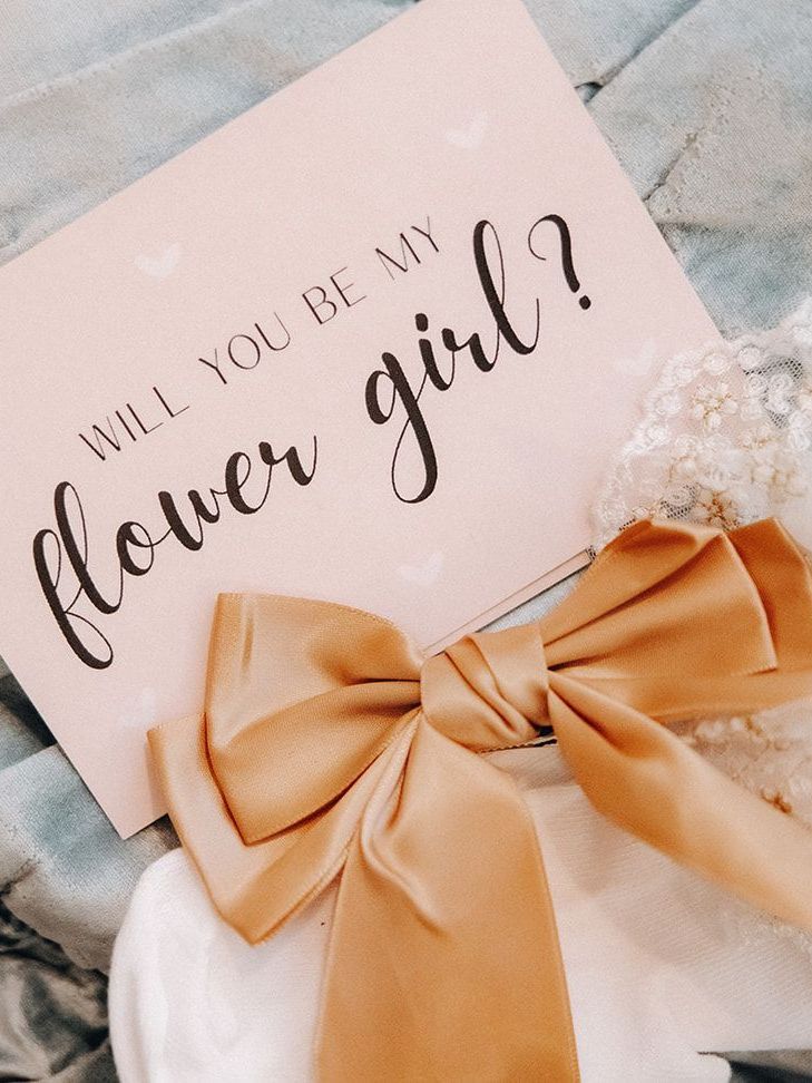 Will you be my flower girl? card with a peach bow and white flowers