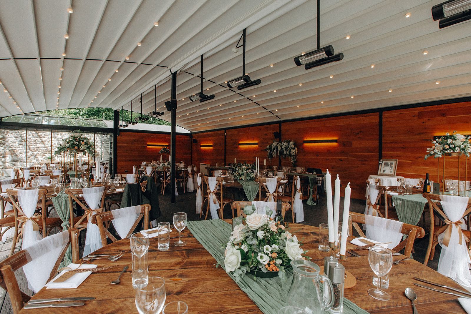 The Glasshouse decorated with white and sage green florals