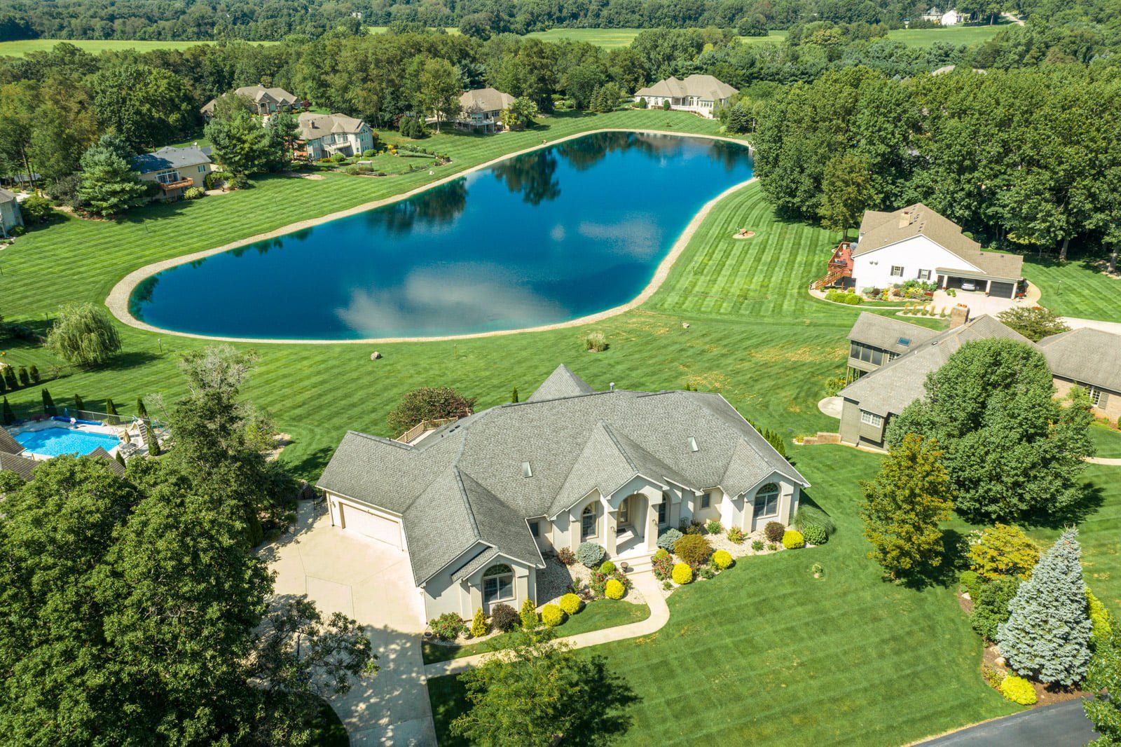 Luxury Houses Surrounding Large Pool – Mishawaka, IN – Jan Lazzara