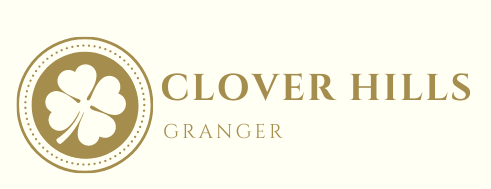 Logo featuring a shamrock in a gold circle, with 