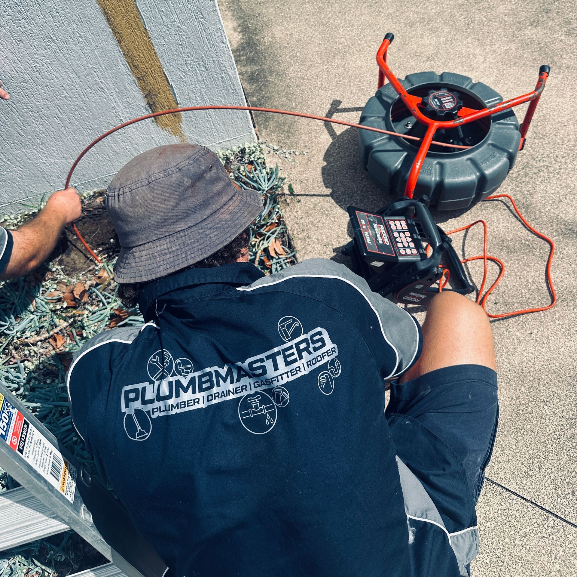 Plumbmasters carrying out a CCTV drain camera inspection on the Gold Coast