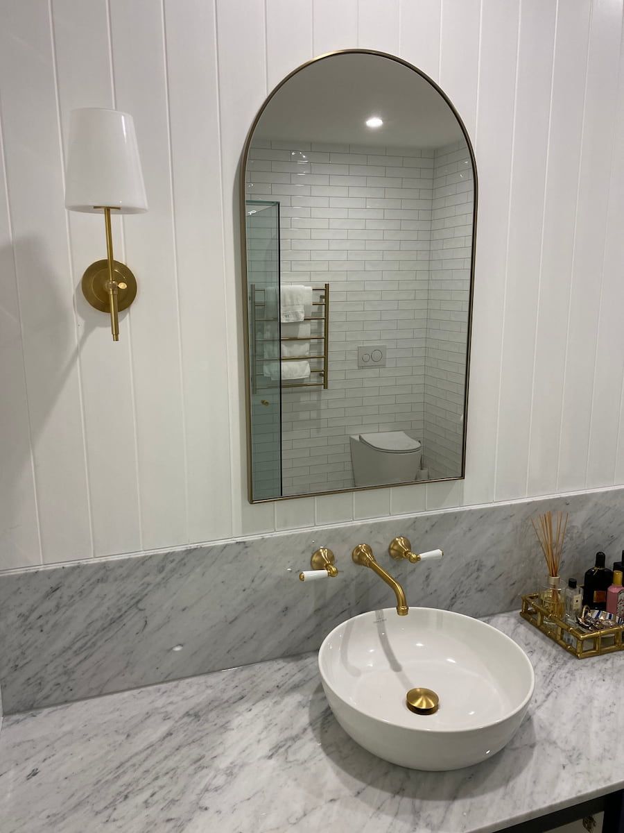 A Bathroom With A Sink And A Mirror On The Wall — Plumbmasters In Burleigh Heads, QLD
