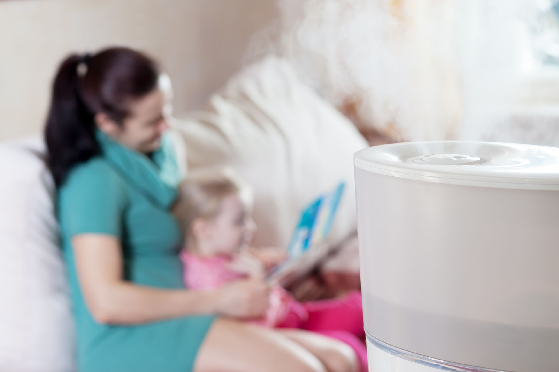 Mother and baby reading a book
