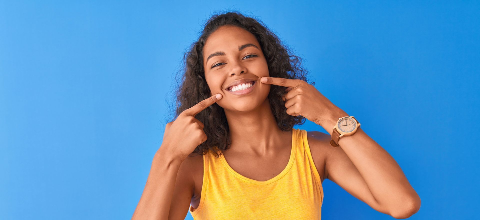 woman pointing at smile