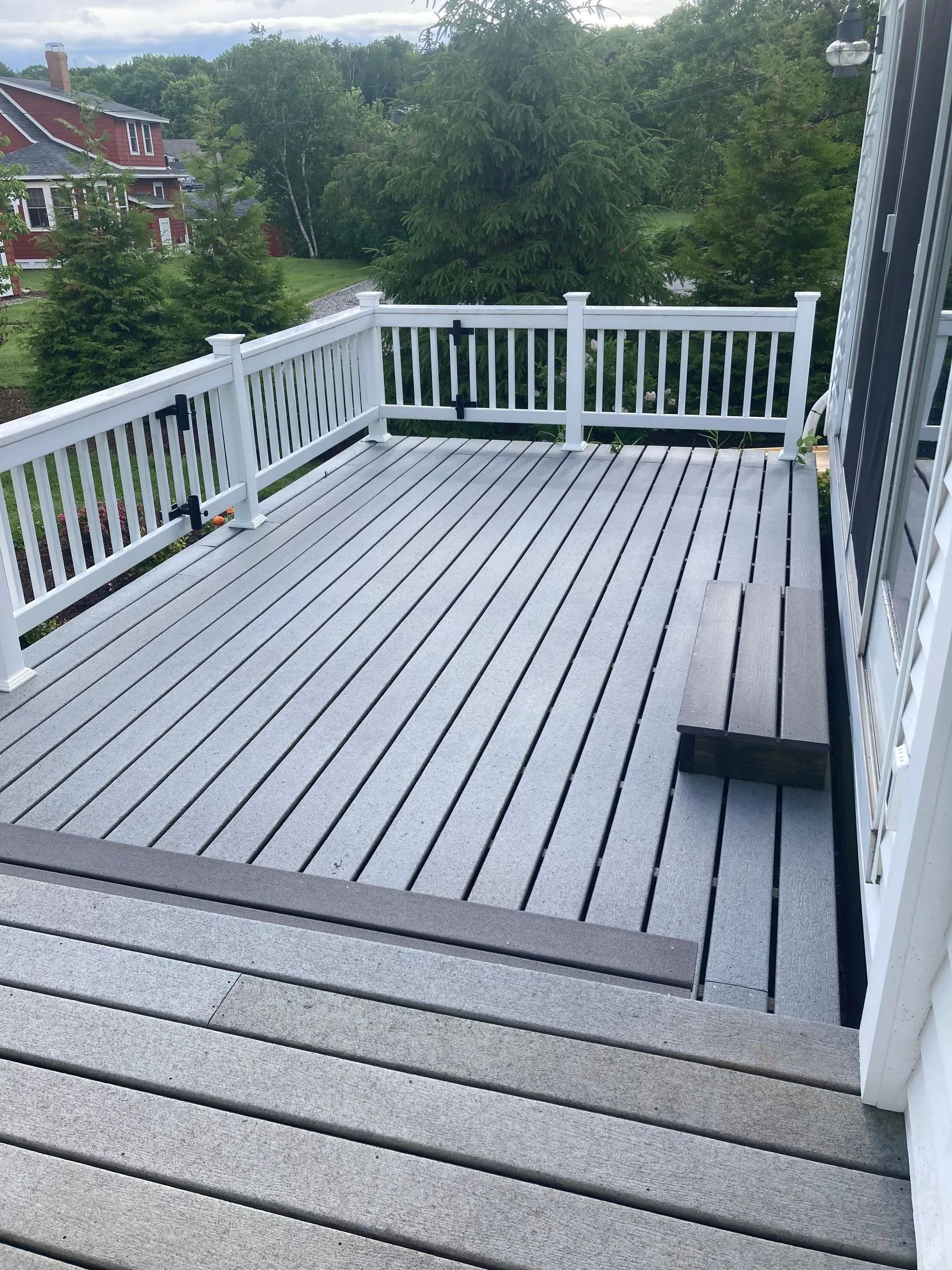 Freshly cleaned wood deck in Belfast, Maine after professional deck cleaning