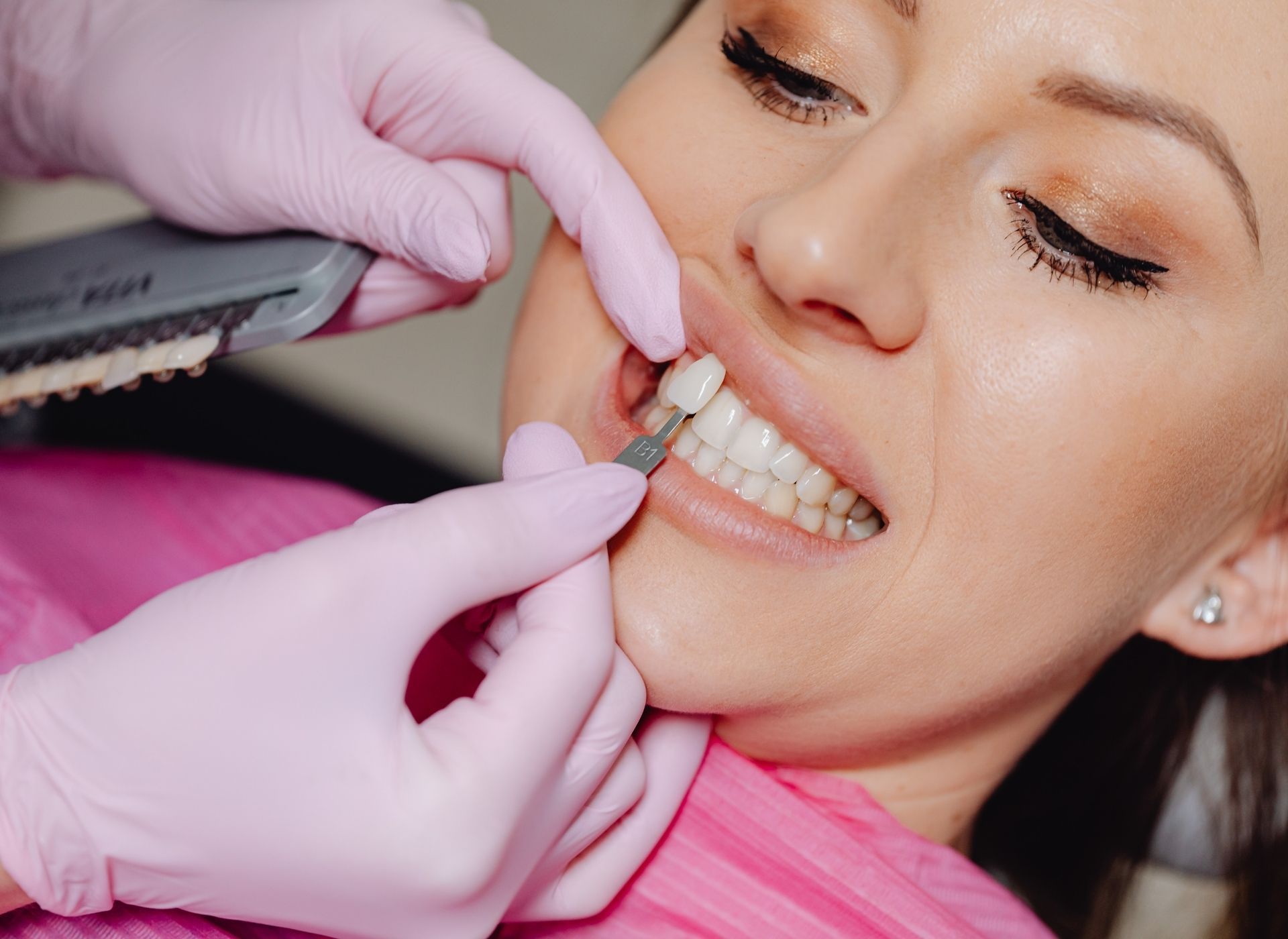 Dentist polishing a patient's teeth with a dental tool during a checkup