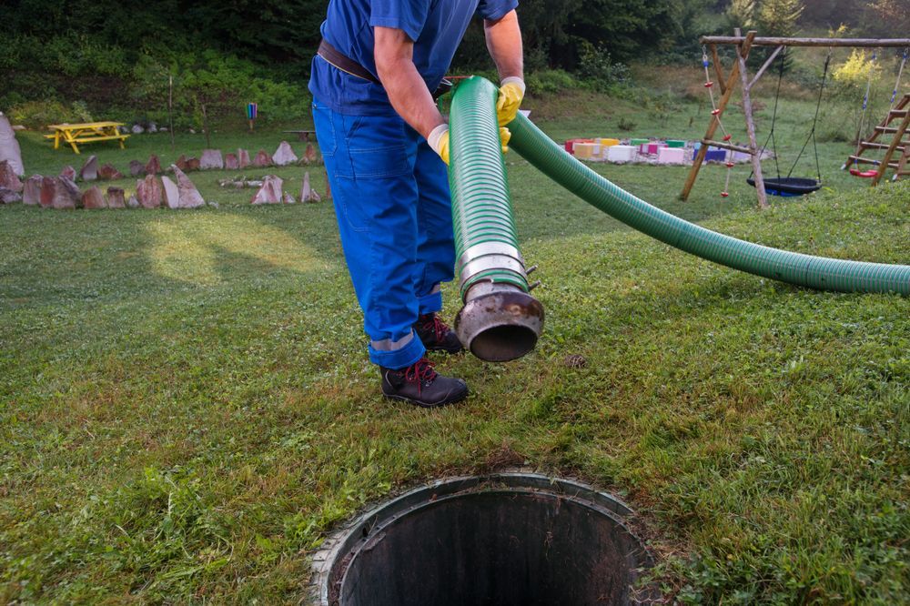 A Man is Pumping Water Into a Septic Tank — KYK Industries in Katherine, NT