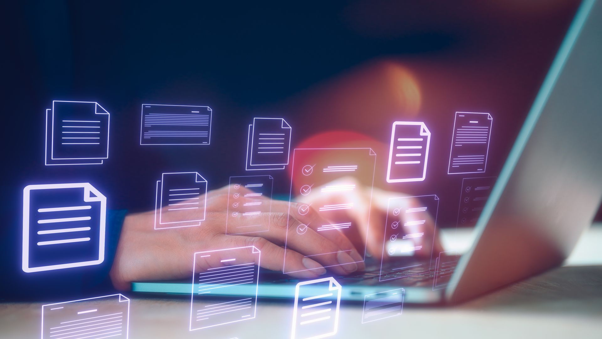 Hands typing on laptop with glowing document icons overlaying the scene.