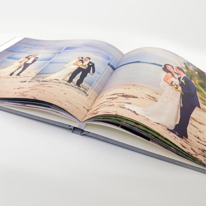Custom photo book on a desk - preserve memories with professional photo books from Fort Worth Camera 