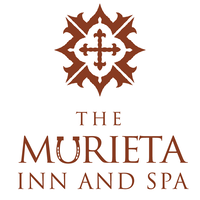 The logo for the murieta inn and spa has a cross on it.
