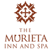 The logo for the murieta inn and spa has a cross on it.