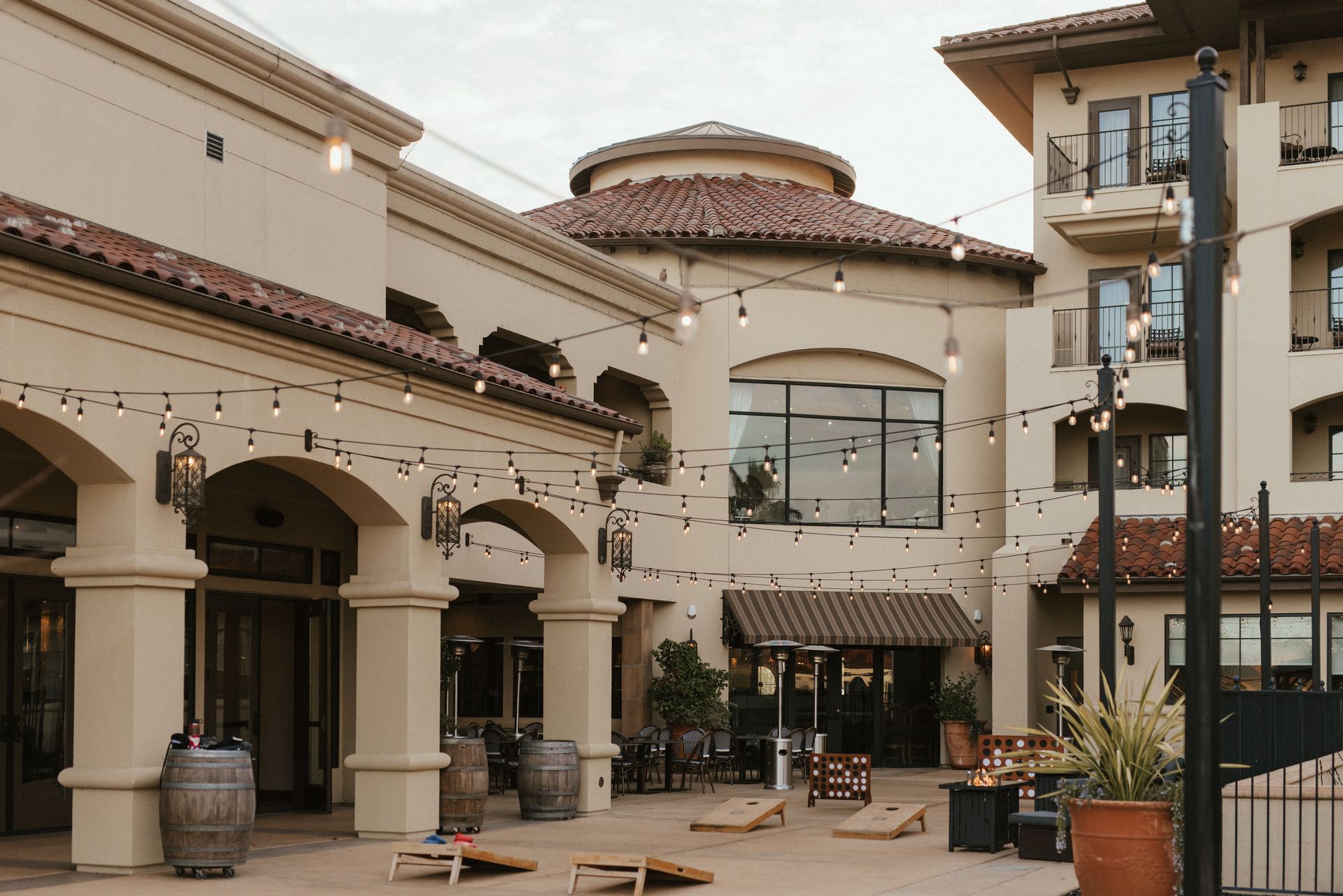 A large building with a patio in front of it.