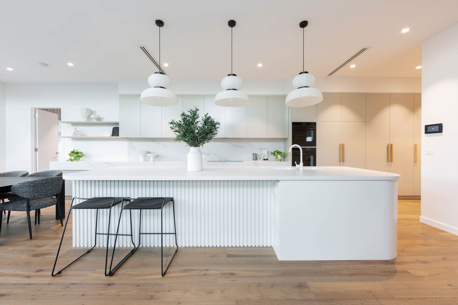 Bright Modern White Kitchen with Island, Pendant Lights — Complete Property Projects In Phillip, ACT