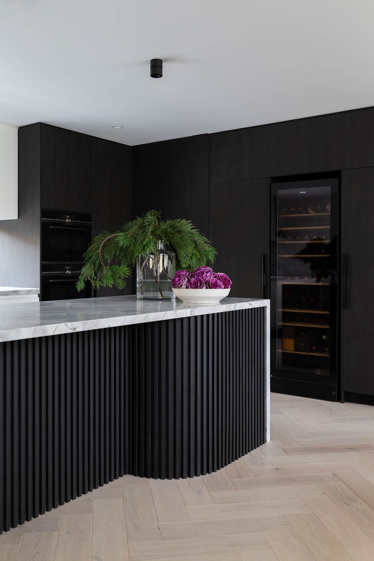 Modern Kitchen with Black Cabinetry, Fluted Island — Complete Property Projects In Phillip, ACT