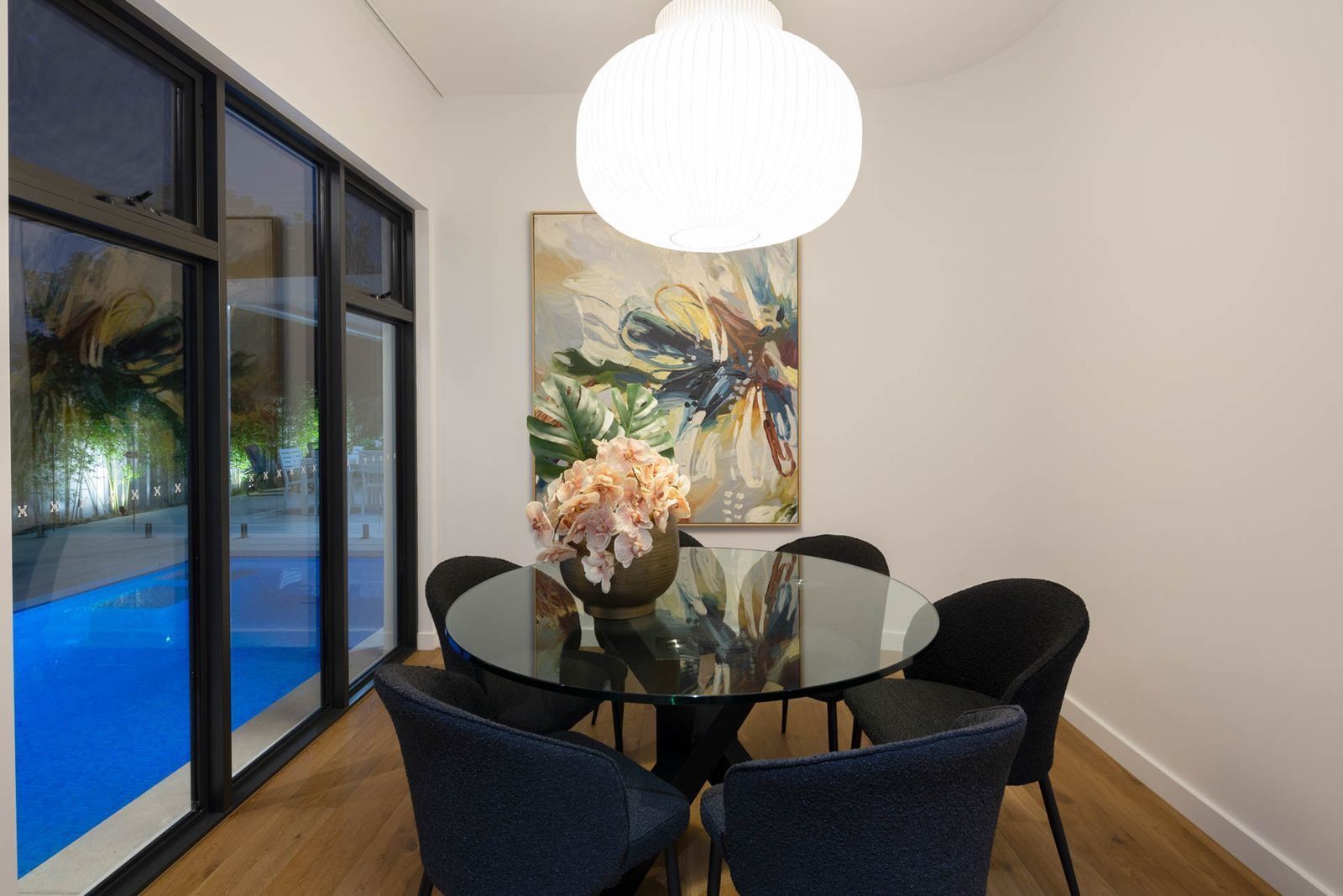 Modern Dining Nook with Round Glass Table — Complete Property Projects In Phillip, ACT