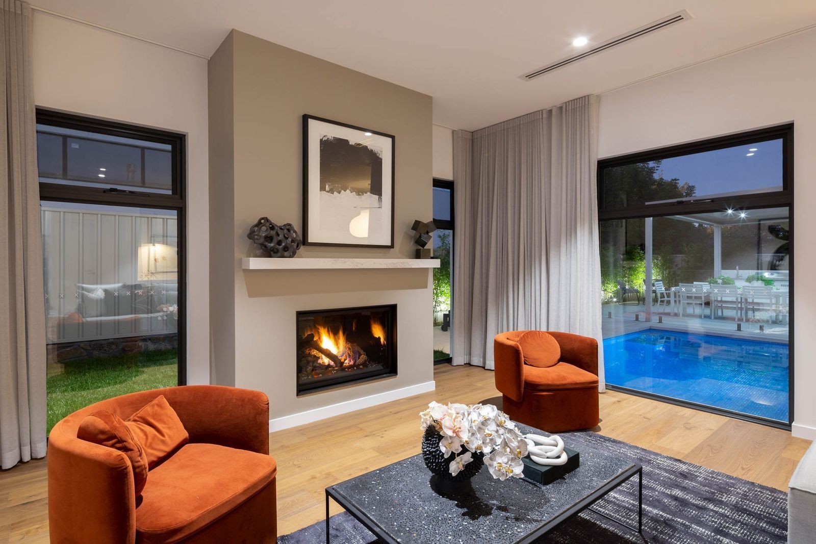 Modern Living Room with Fireplace, Orange Chairs — Complete Property Projects In Phillip, ACT
