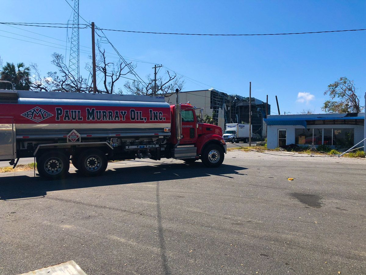 Red and Silver Tanker Truck on the Road — Jacksonville, FL — Paul Murray Oil Inc Red and Silver Tanker Truck on the Road — Jacksonville, FL — Paul Murray Oil Inc