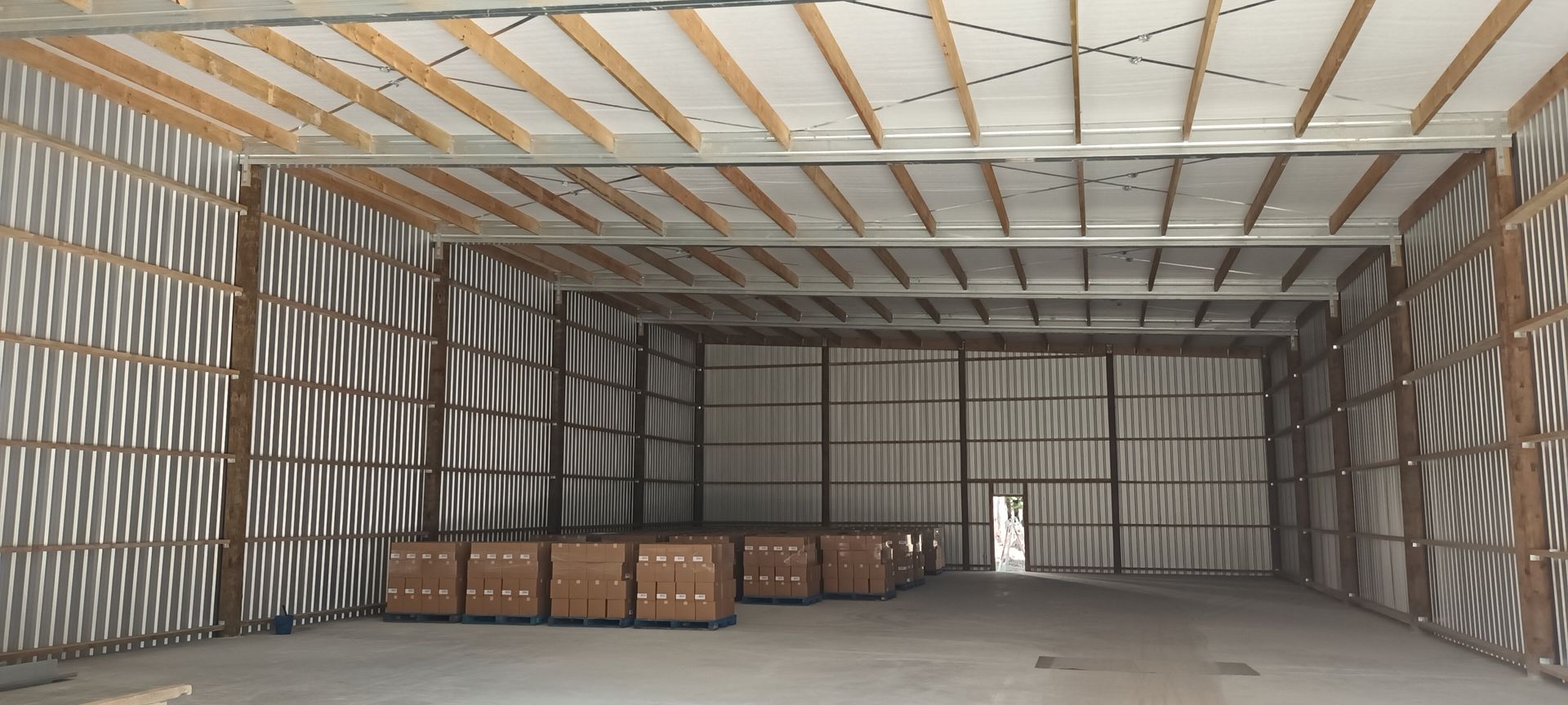 A large warehouse with a lot of boxes in it.