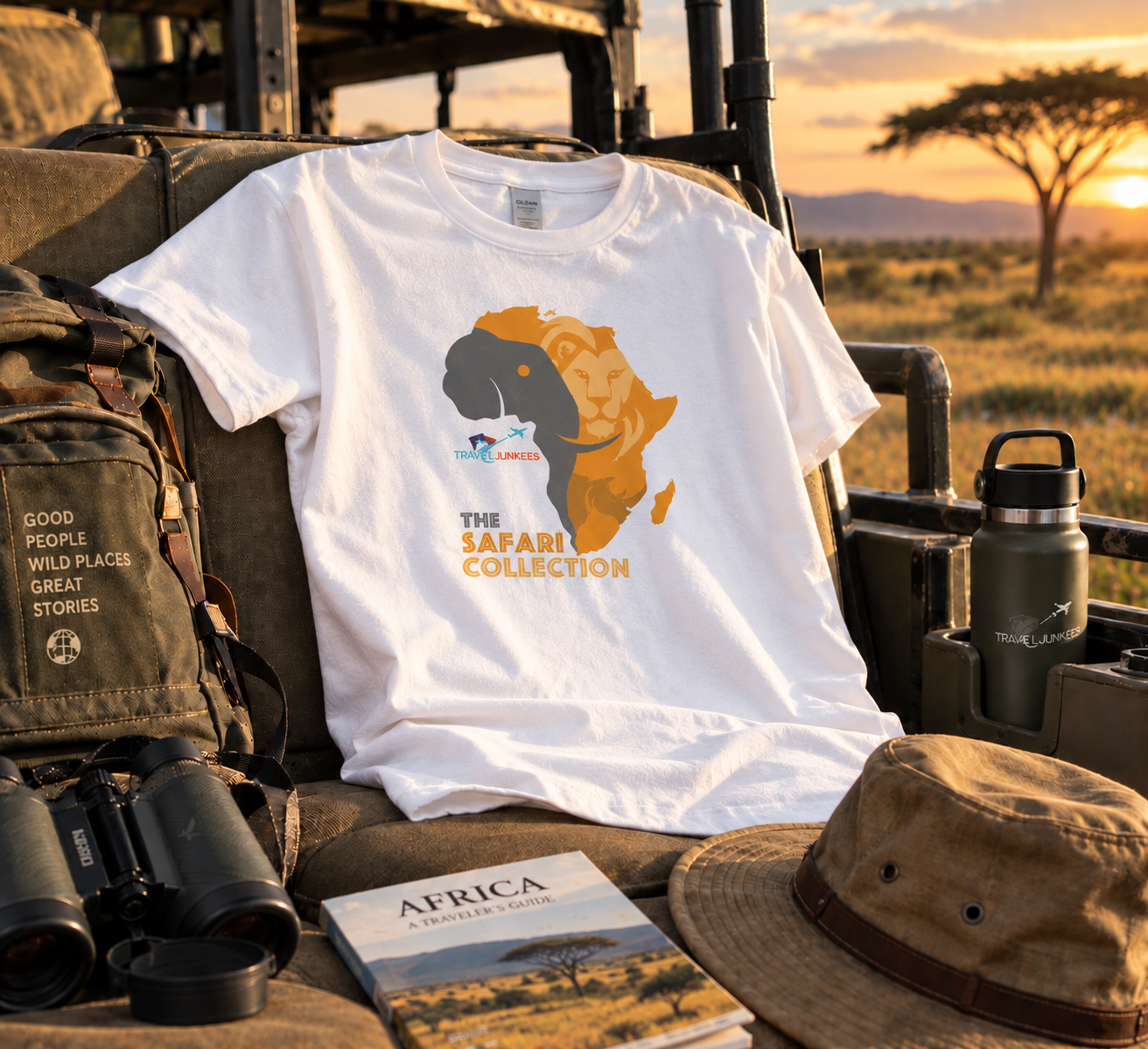 Black T-shirt with Africa graphic displayed among safari gear at sunset.