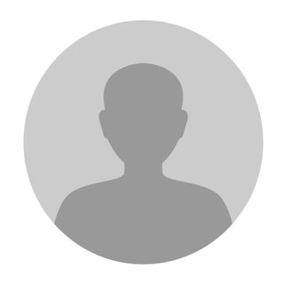 A gray silhouette of a person’s head and shoulders inside a gray circle.