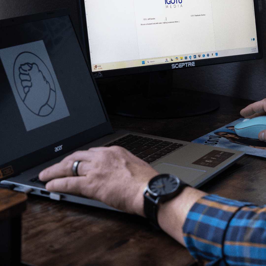 A person is typing on an acer laptop