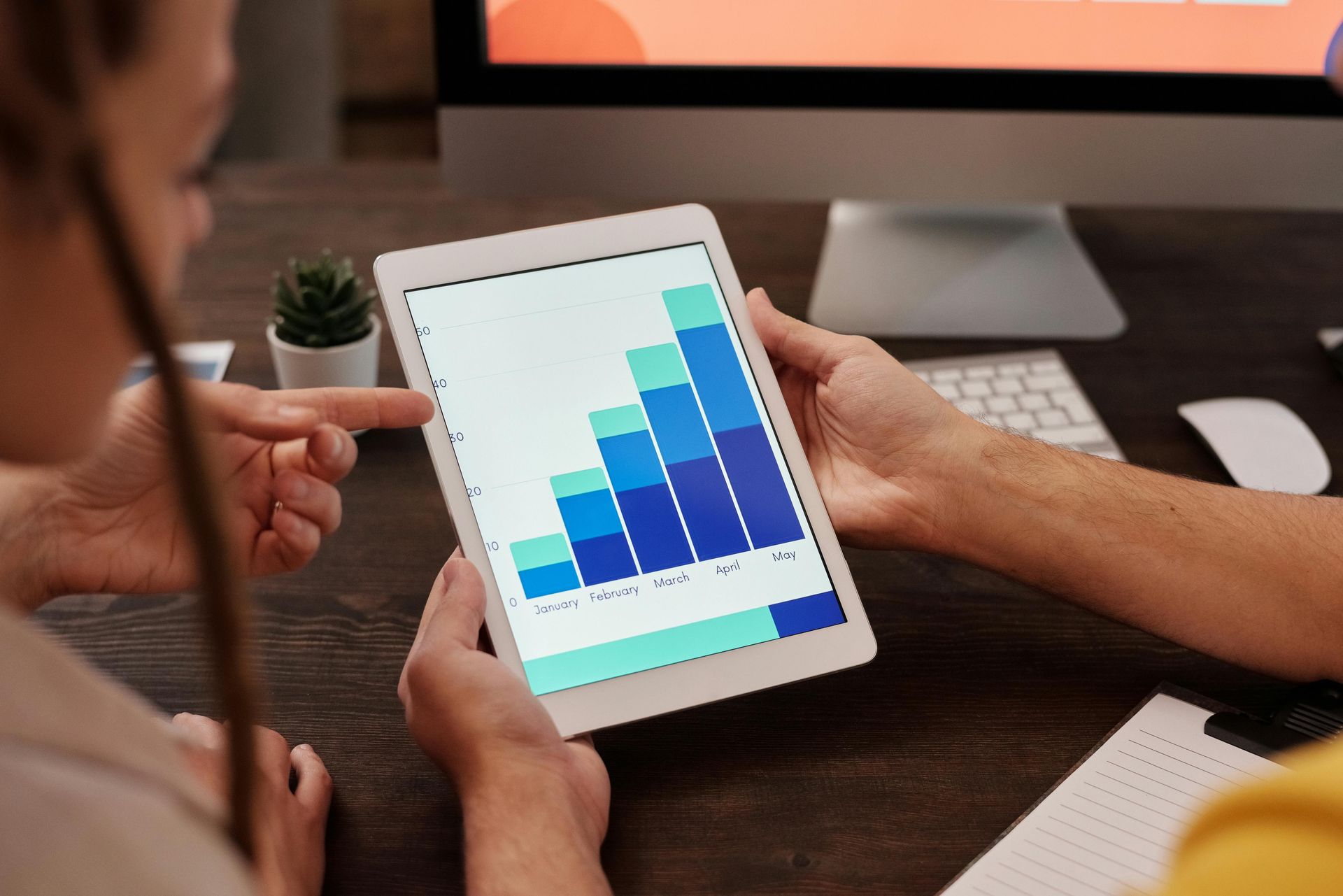 Business owner analyzing digital performance metrics. Business owner analyzing digital performance metrics.