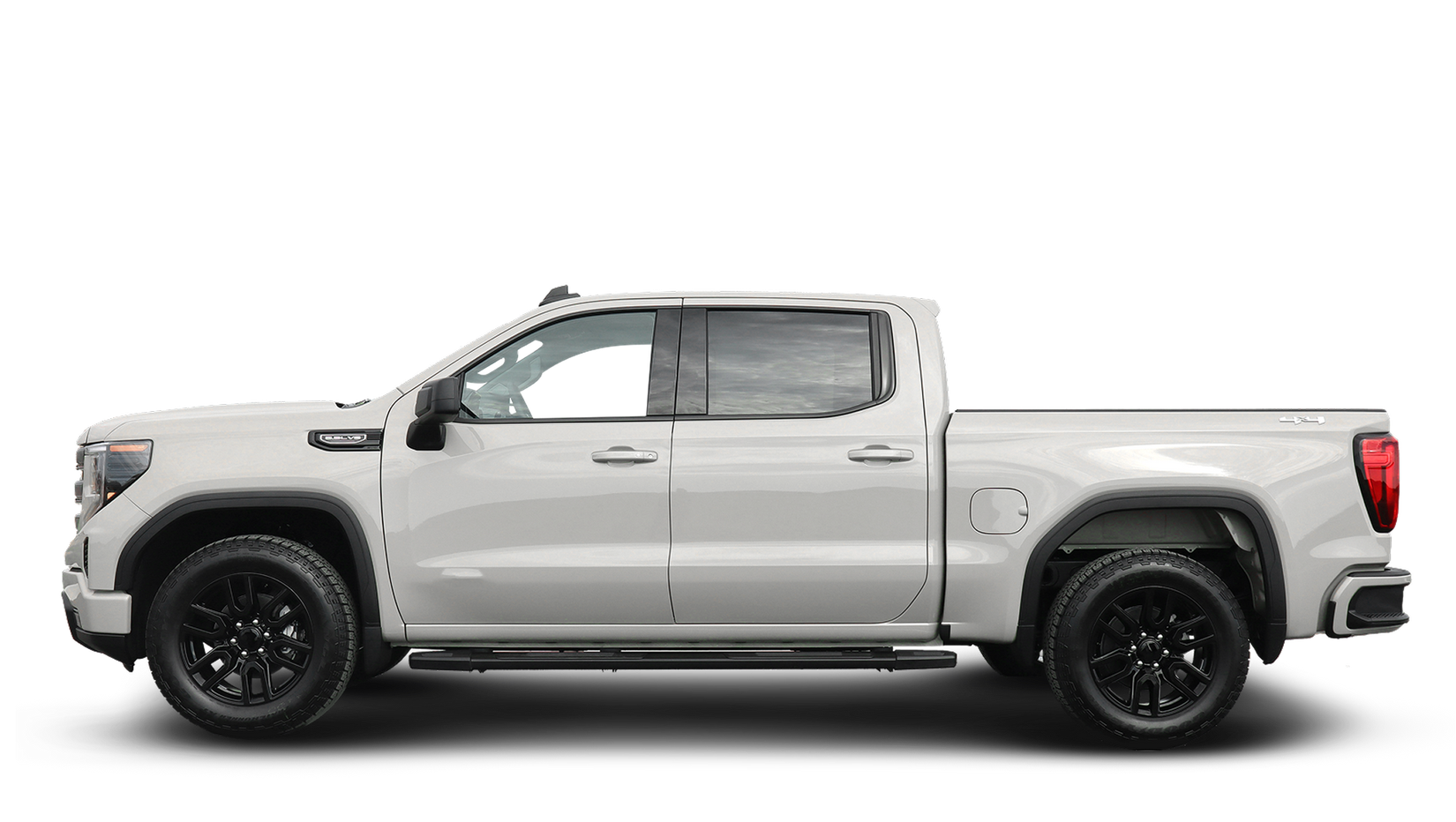 Side view of a silver pickup truck with black wheels on a white background