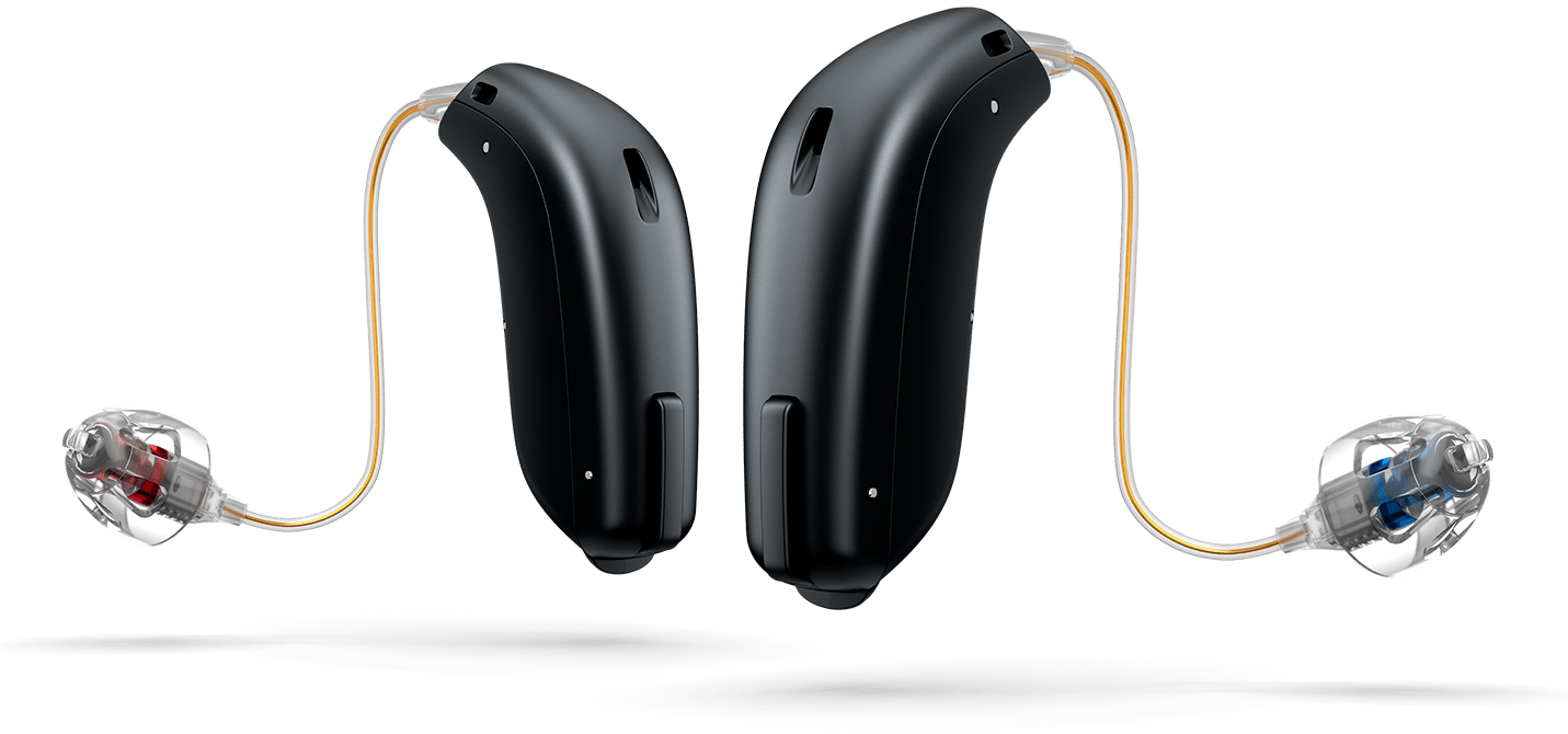 Two black behind-the-ear hearing aids with clear ear molds and thin wires on a white background
