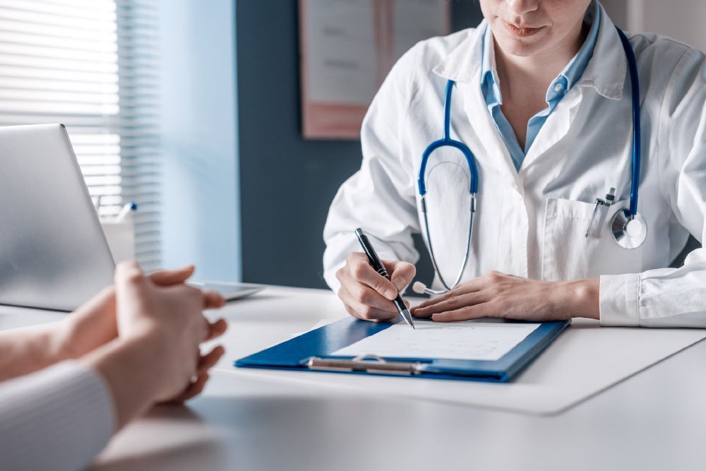 Doctor Writing a Medical Prescription — Ville Platte, LA — Vidrine Community Clinic