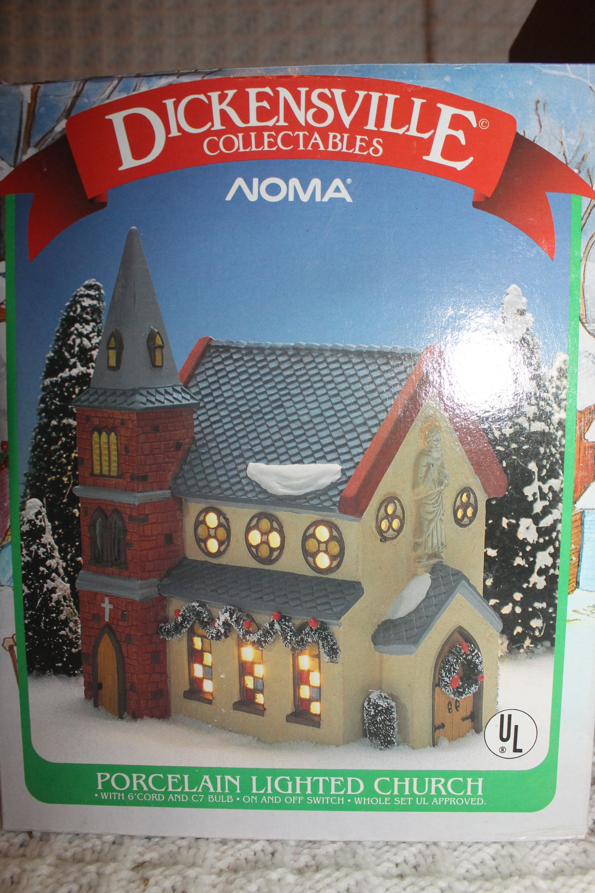 Dickensville collectible church box with a red banner, showing a miniature church illustration on the front.