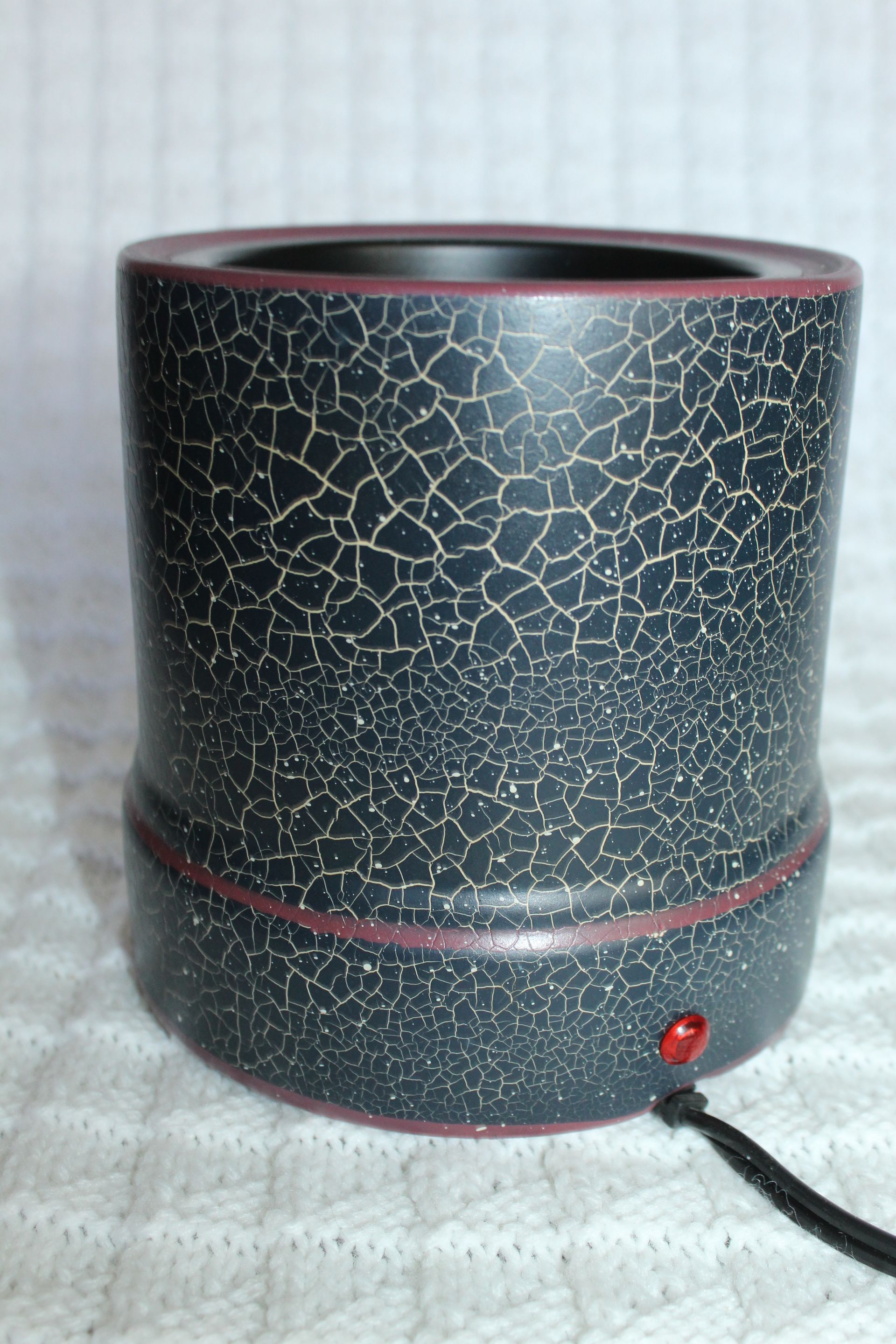 Snowman holiday ceramic mug warmer with Christmas lights and a black power cord