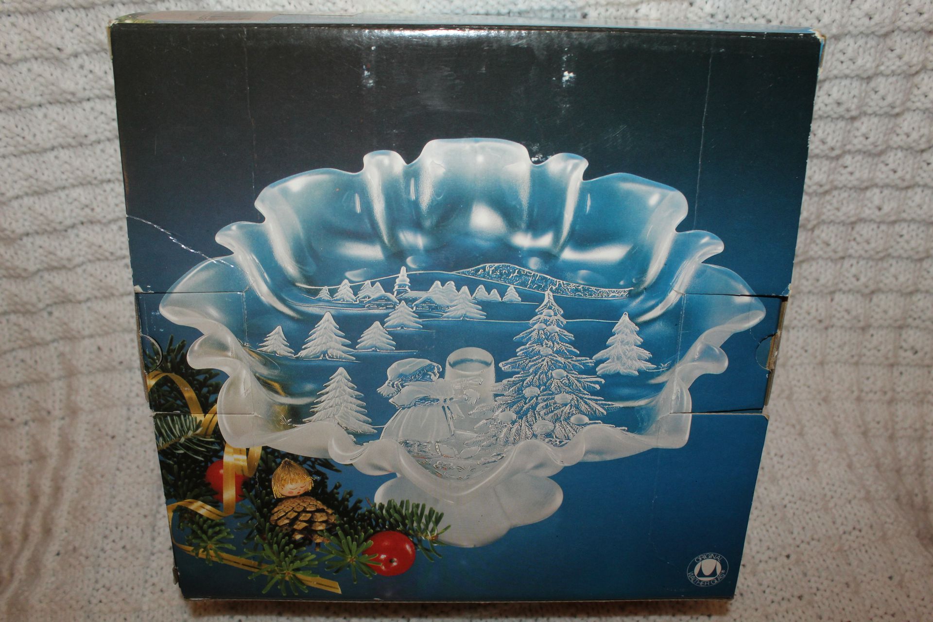 Clear glass bowl with a frosted Christmas tree design on a wooden table