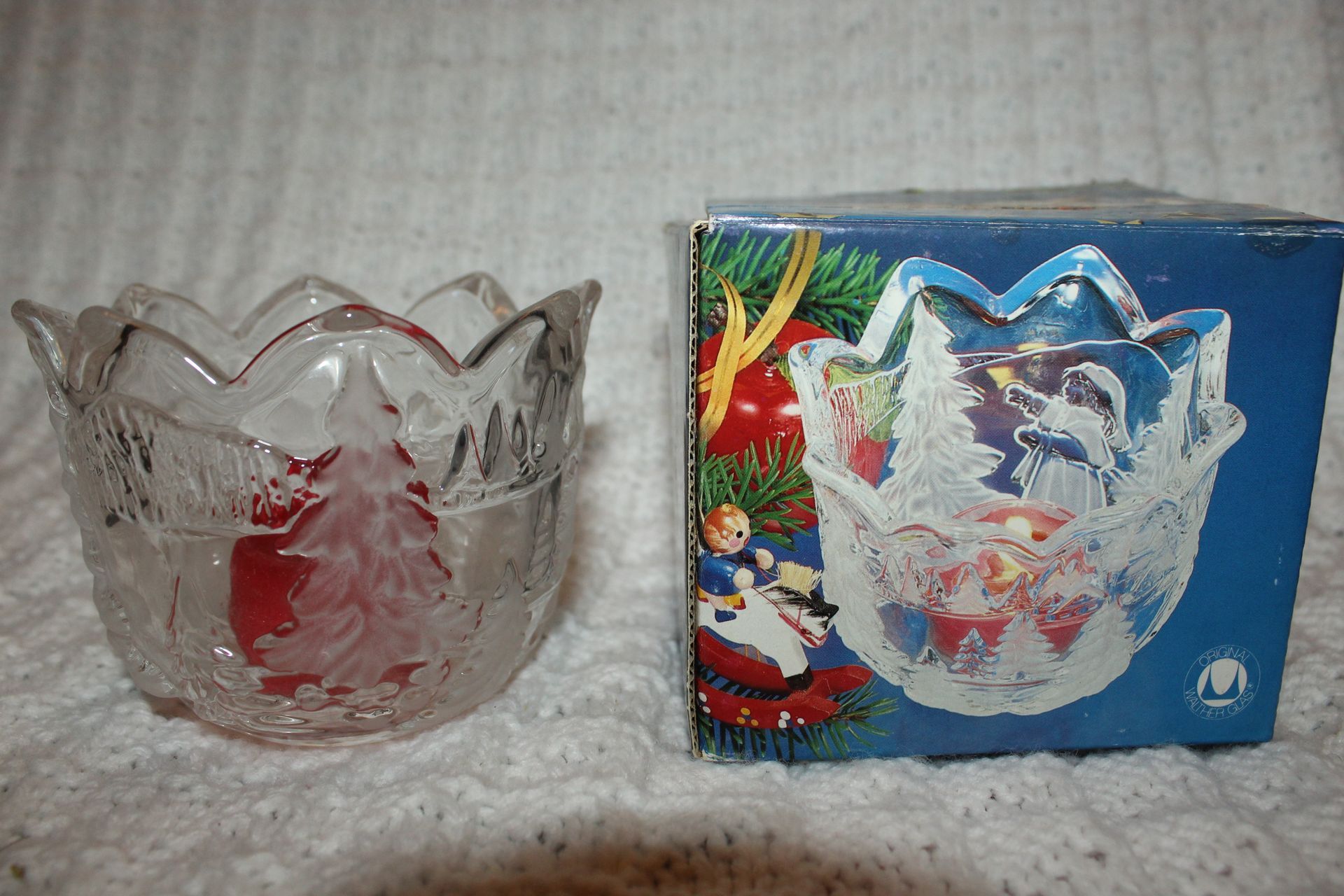 Clear glass bowl on a red plaid blanket