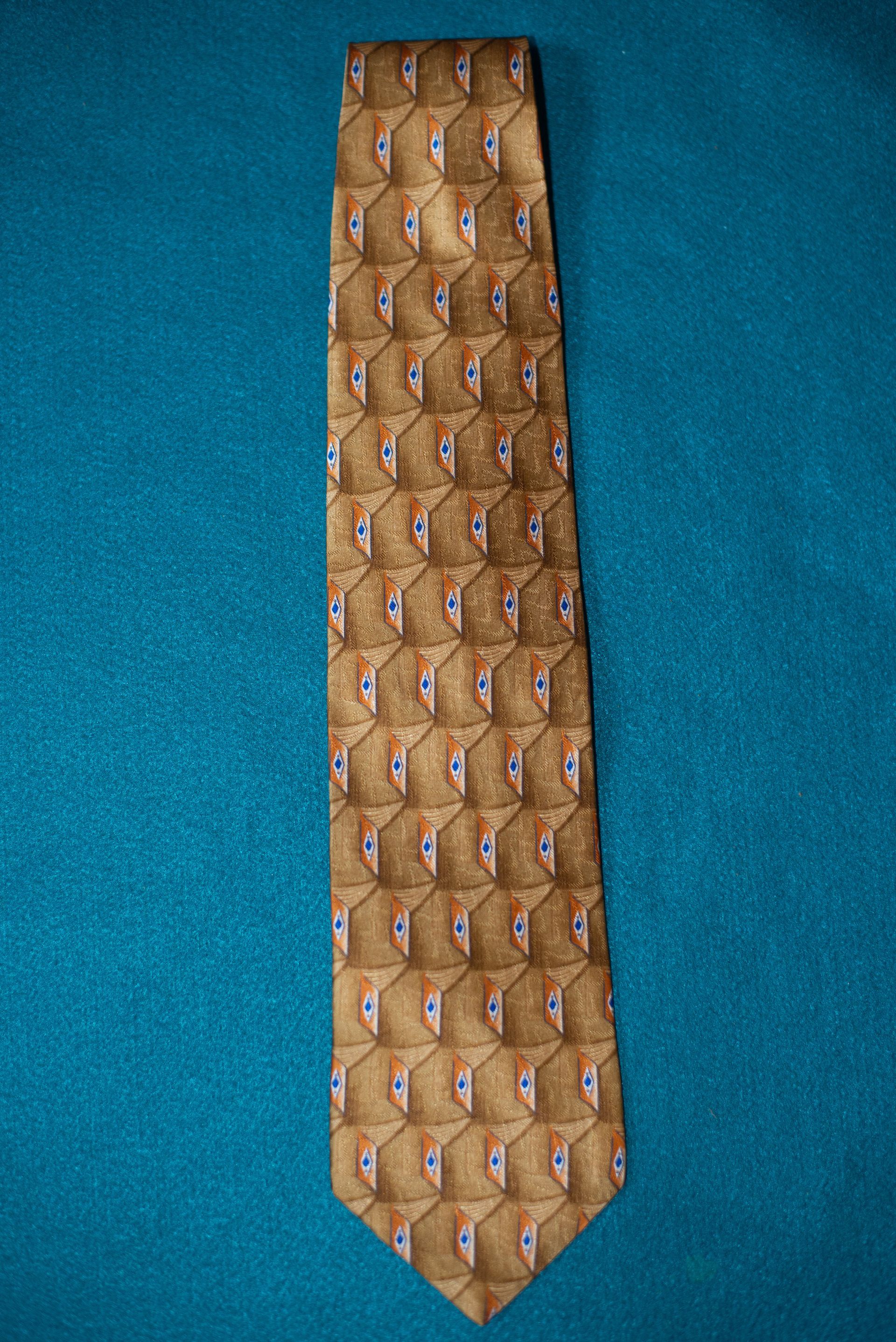 Brown patterned necktie on a blue background.