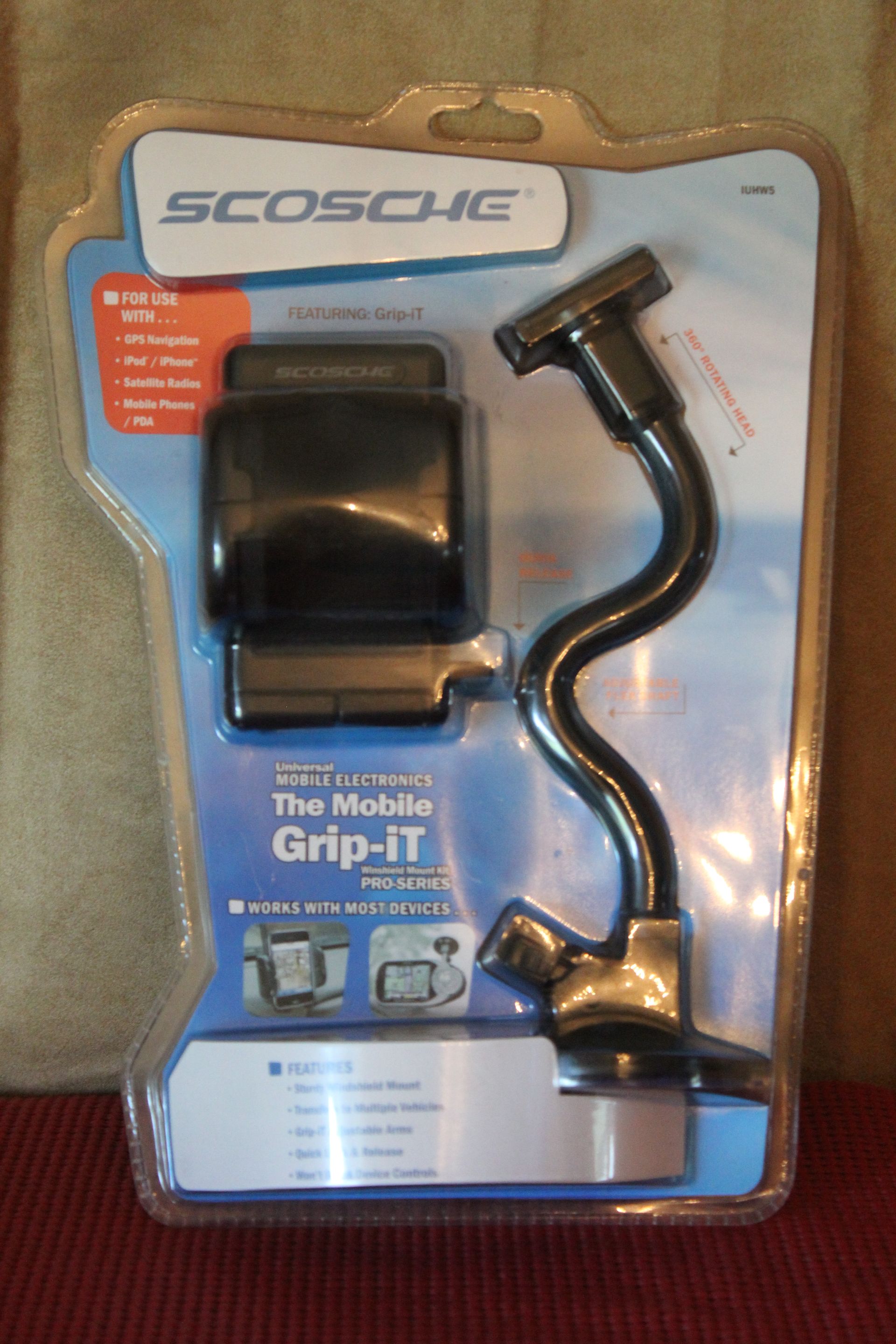 Scosche mobile phone car mount in blue blister packaging with a suction cup arm and clip holder