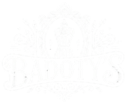 Faint embossed illustration of a decorative circular emblem with small figures and patterns on a white background