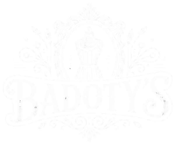 Faint embossed illustration of a decorative circular emblem with small figures and patterns on a white background