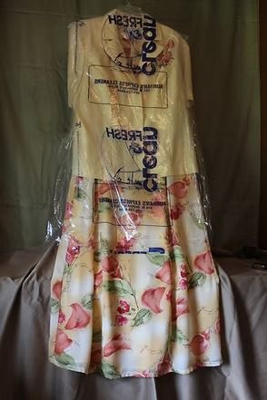 Cream short-sleeve blouse with floral skirt displayed on a hanger