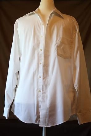 White long-sleeve button-down shirt with a chest pocket on a mannequin