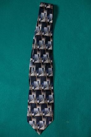 Patterned necktie on a green background