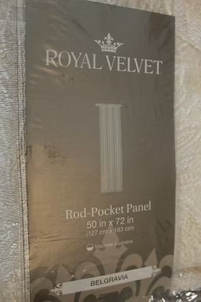 Royal Velvet rod-pocket panel curtain package in taupe with white text and curtain illustration