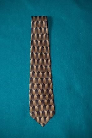 Brown patterned necktie on a teal background